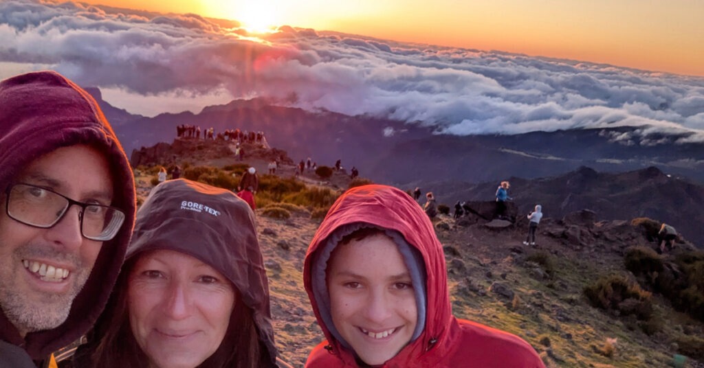 John, Cheryl and Alfie (and a throng of other people) enjoy sunrise on Pico do Areeiro.
